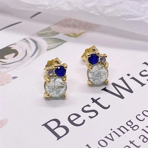 Detailed close-up of S925 sterling silver earrings with blue and clear gemstones