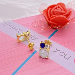 Close-up of S925 silver stud earrings with blue gemstone and white zircon in a gift box
