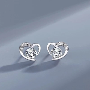 Close-up of S925 sterling silver heart earrings with sparkling cubic zirconia inlay
