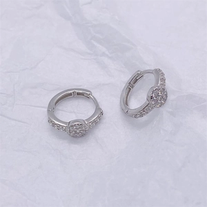 Close-up of S925 sterling silver hoop earrings with sparkling cubic zirconia stones