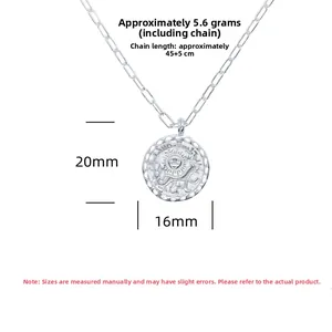 Macro shot of S925 silver sun coin pendant and paperclip chain necklace details