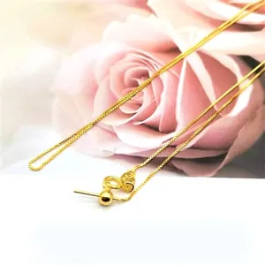 Detail of adjustable 18K gold box chain with positioning bead and metal hallmark