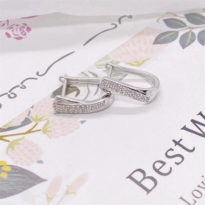 Close-up of S925 sterling silver U-shaped earrings with micro-pave cubic zirconia accents
