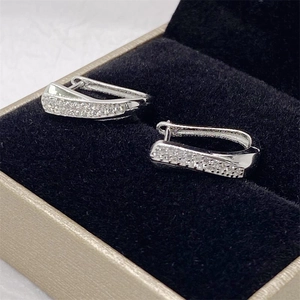 Close-up of S925 sterling silver hoop earrings with cubic zirconia in a jewelry box