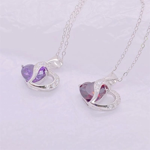 S925 sterling silver heart necklace with purple and red gemstones on white paper
