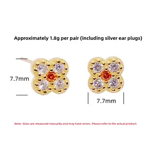 Detail of S925 sterling silver four-leaf clover stud with orange center stone and zircons