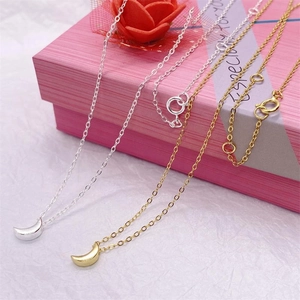 Elegant S925 sterling silver crescent moon necklaces in gold and silver on a gift box