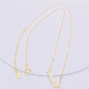 Detail shot of gold S925 sterling silver stamp and clasp on double row bar necklace