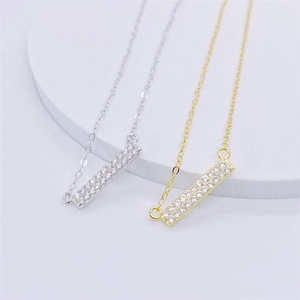Dual-tone silver and gold bar necklaces with rows of sparkling pavé-set zircons