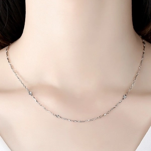 Elegant S925 sterling silver chain necklace with textured links on female model neck