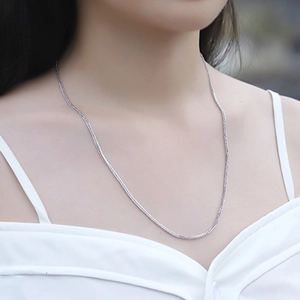 Classic 925 sterling silver Chopin chain necklace elegantly worn by a female model