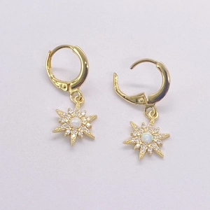 Detail of S925 sterling silver sunflower earrings with opal center and zircon stones