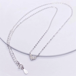 Macro shot showing S925 sterling silver stamp and heart pendant with zircon stones