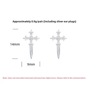 Detailed view of S925 sterling silver cross studs with vintage floral engraving