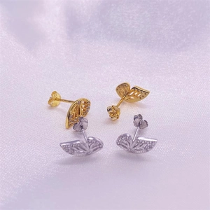 Detail of S925 sterling silver butterfly stud earrings with sparkling crystals