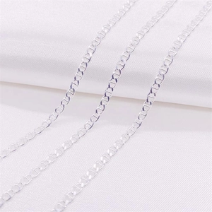 Polished S925 sterling silver anchor chain necklace displayed on white silk fabric