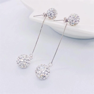 Macro shot of S925 sterling silver tassel earrings with glittering paved crystal balls