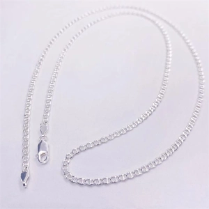 Detail of S925 sterling silver long chain with lobster clasp on grey background