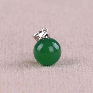 Close-up of S925 sterling silver stamp on green agate spherical pendant necklace