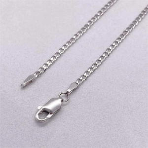 Classic S925 sterling silver curb chain with lobster clasp on a textured gray background