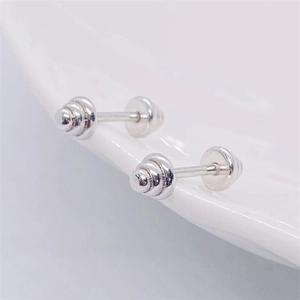 Detail of S925 sterling silver dumbbell earrings with screw back and tiered cone design