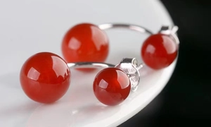Macro view of S925 sterling silver stamp on red agate stud earrings detail