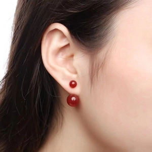 S925 sterling silver red agate double bead earrings shown on a model with side profile
