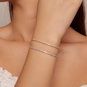Close-up of stacked S925 sterling silver tennis bracelets with glittering cubic zirconia