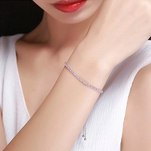 Pink zircon tennis bracelet with silver base and adjustable drawstring clasp for women