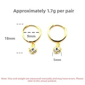 Detailed view of gold plated sterling silver hoop earrings with cubic zirconia charms