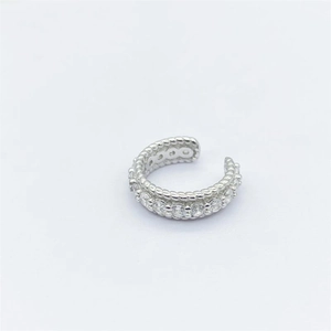 Close-up of S925 silver ear cuff featuring twisted rope texture and pavé cubic zirconia