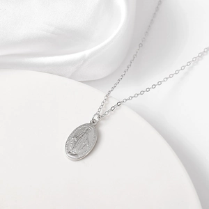 Minimalist S925 sterling silver Virgin Mary oval pendant necklace on white stand