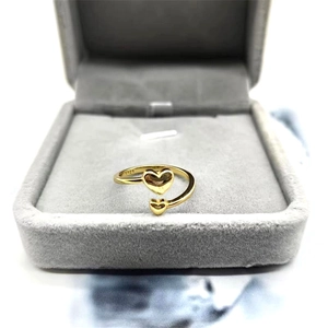 Detail of S925 sterling silver stamp on golden double heart minimalist open ring