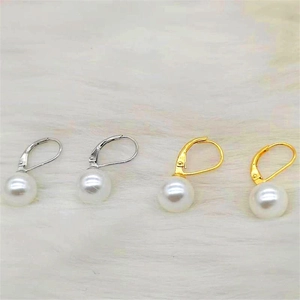 Detail of S925 sterling silver leverback earrings with white shell pearls in gold and silver