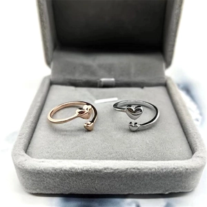 Close-up of S925 sterling silver heart rings in rose gold and silver finishes