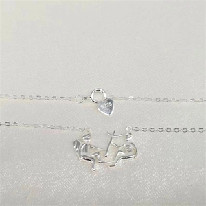 Detail of S925 sterling silver angel and demon pendant with lobster clasp on O-chain