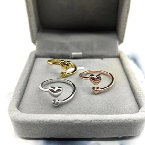 Three minimalist S925 sterling silver heart rings in gold, silver and rose gold finish