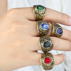 Vintage gold US Army eagle rings with oval red blue black green gemstones
