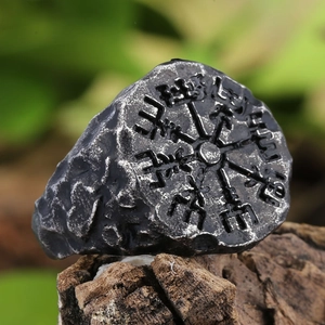 Macro shot of Viking Vegvisir compass engraving on vintage steel ring for men
