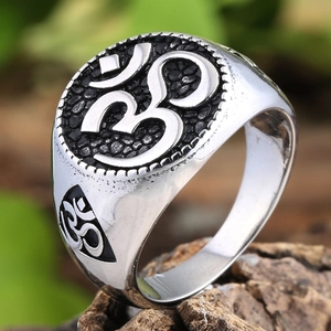 Retro stainless steel ring with Om symbol and black matte texture in a 45-degree view