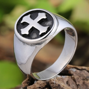 Vintage silver signet ring for men featuring a black cross design on rustic wood base