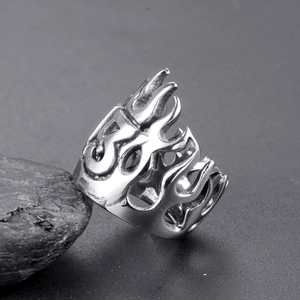 Detailed view of hollow flame pattern engraving on men's vintage stainless steel ring