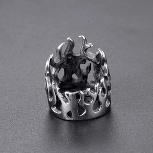 Detailed close-up of retro punk flame pattern on stainless steel biker ring band