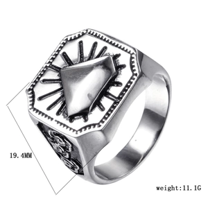 Detailed macro view of vintage titanium steel ring with geometric triangle and radial patterns