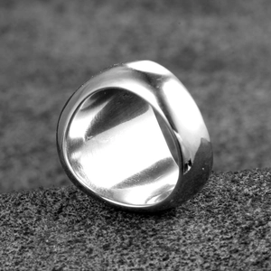 Minimalist wide band titanium steel ring with polished silver finish in industrial style