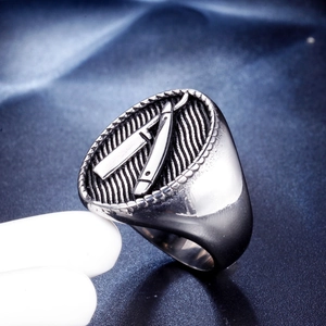 Retro stainless steel barber signet ring for men featuring a razor relief on a blue surface