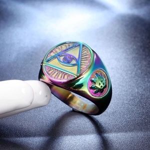 Macro detail of rainbow plated stainless steel ring featuring All-Seeing Eye and leaf relief