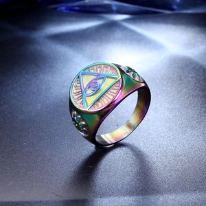 Detailed view of rainbow stainless steel ring featuring engraved Eye of Providence symbol