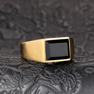 Classic men's gold stainless steel signet ring with a rectangular black onyx gemstone