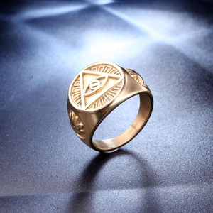 Macro shot of gold Evil Eye signet ring for men showing intricate engraved eye detail